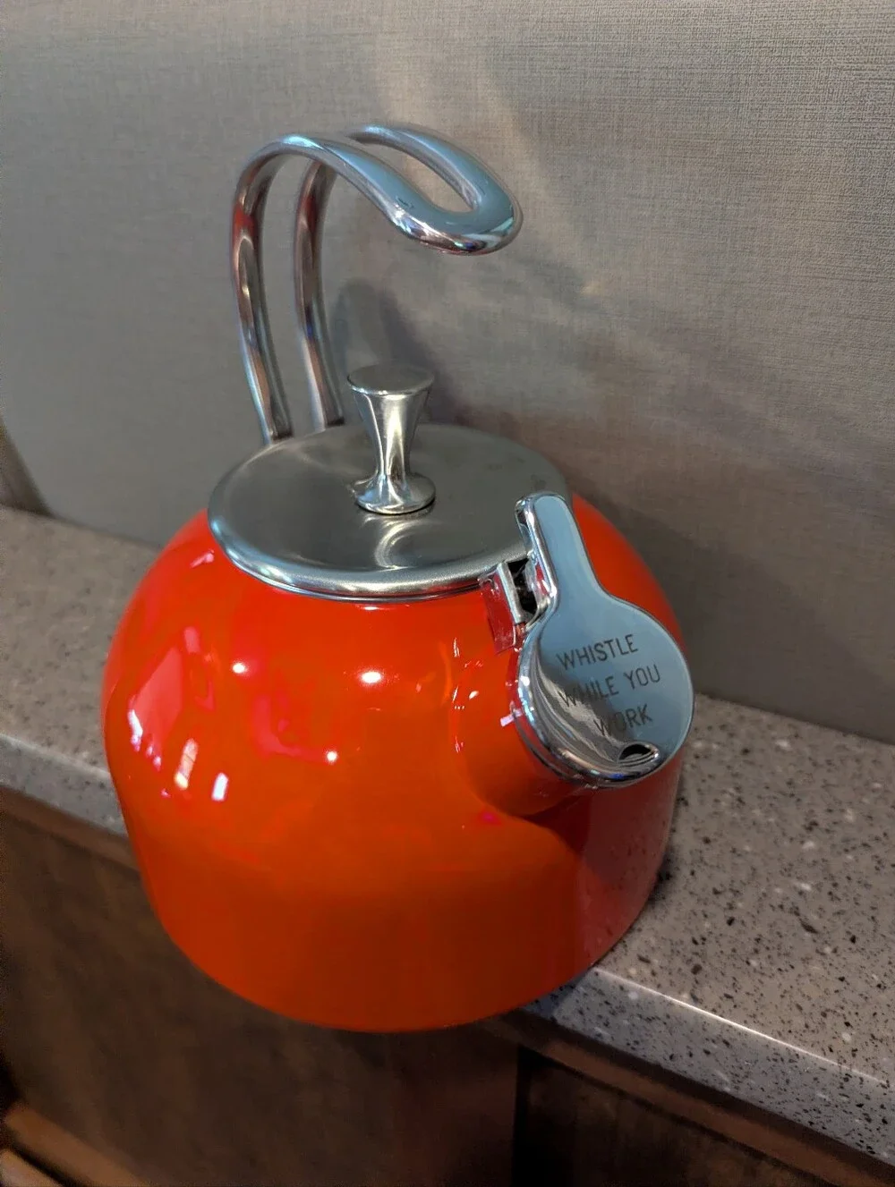 Kate Spade Orange Whistling Tea Kettle with Polished Silver Accents